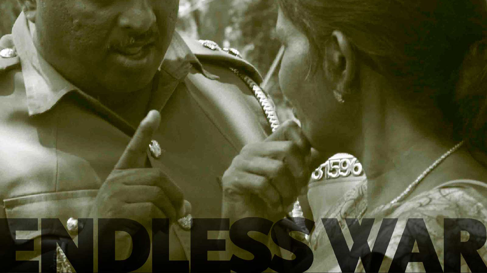 Police warning communities protesting in front of an army camp demanding release of their land