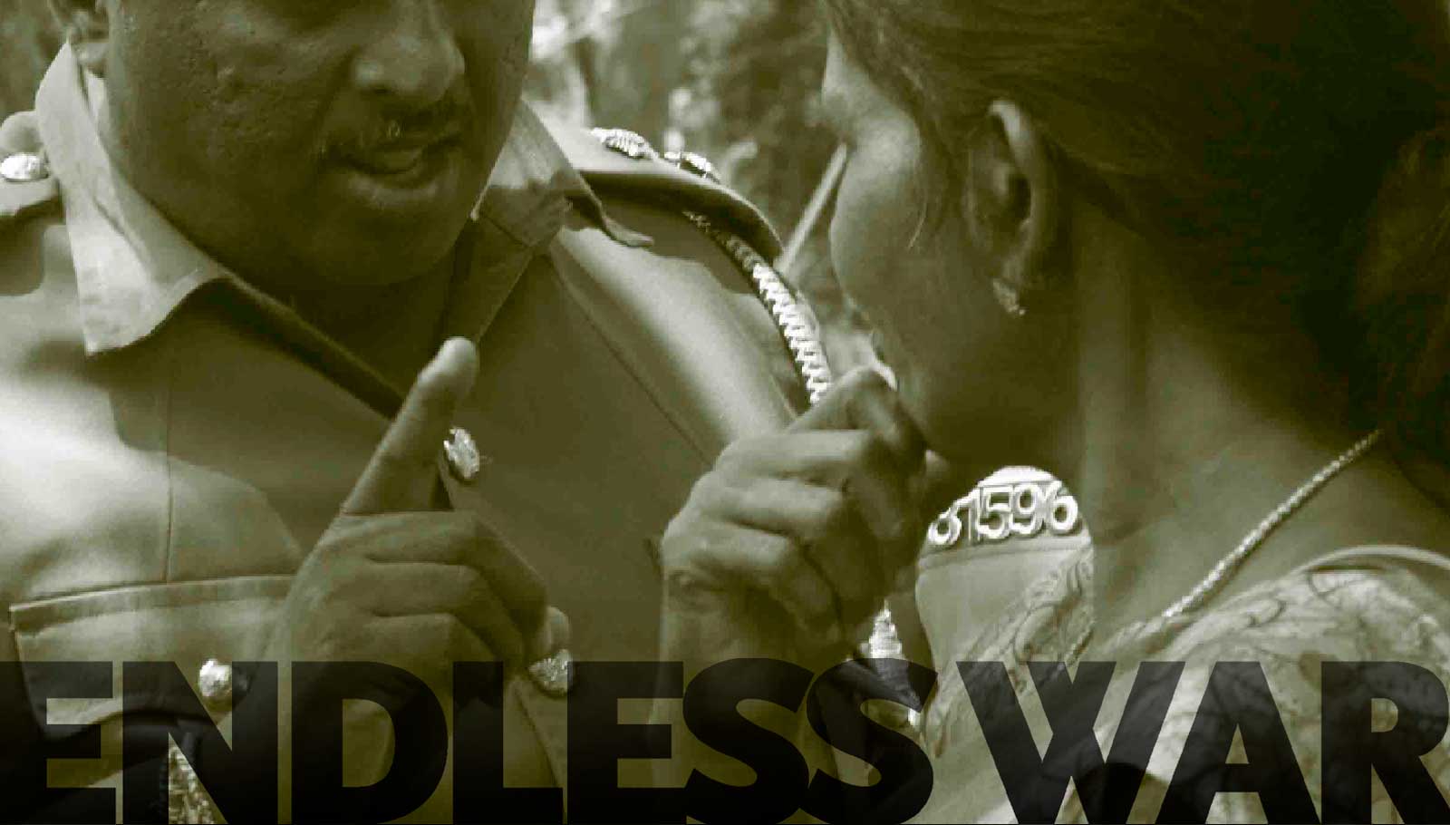 Police warning communities protesting in front of an army camp demanding release of their land