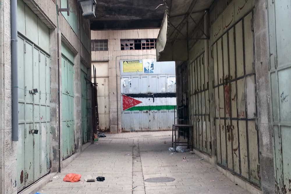 Welded shut doors of shops and homes in the Old City. Credit: The Oakland Institute
