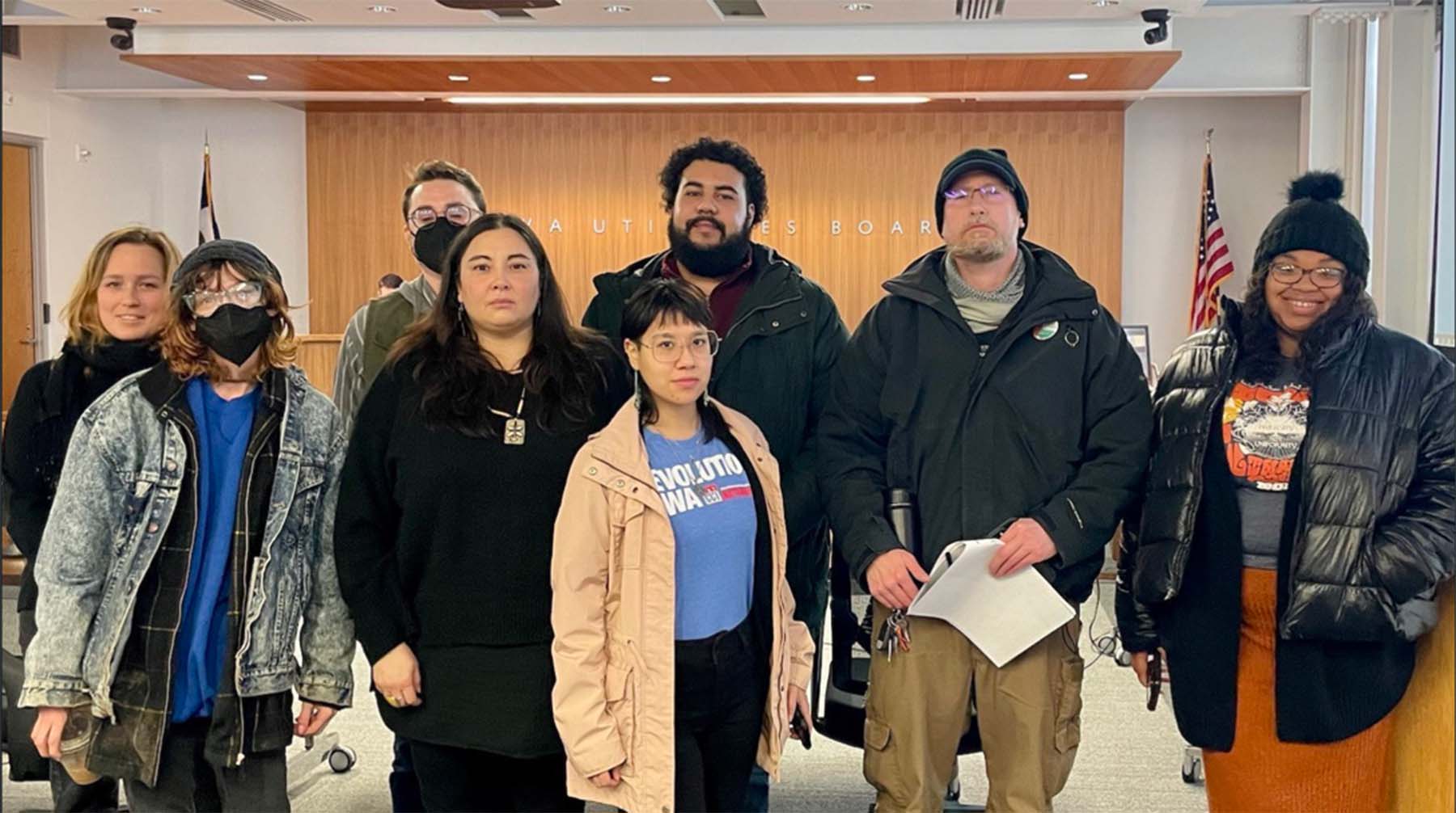 Community members standing in front of the Utilities Board office.