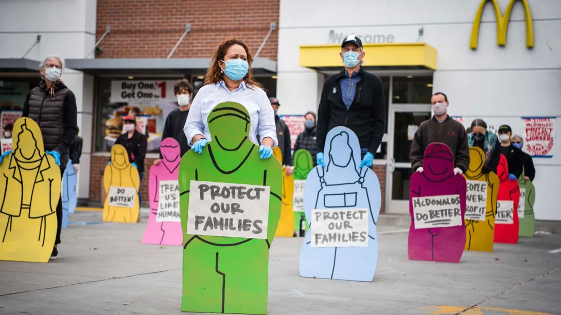 Faith and community leaders held silhouettes of striking workers, unable to attend due Covid-19.