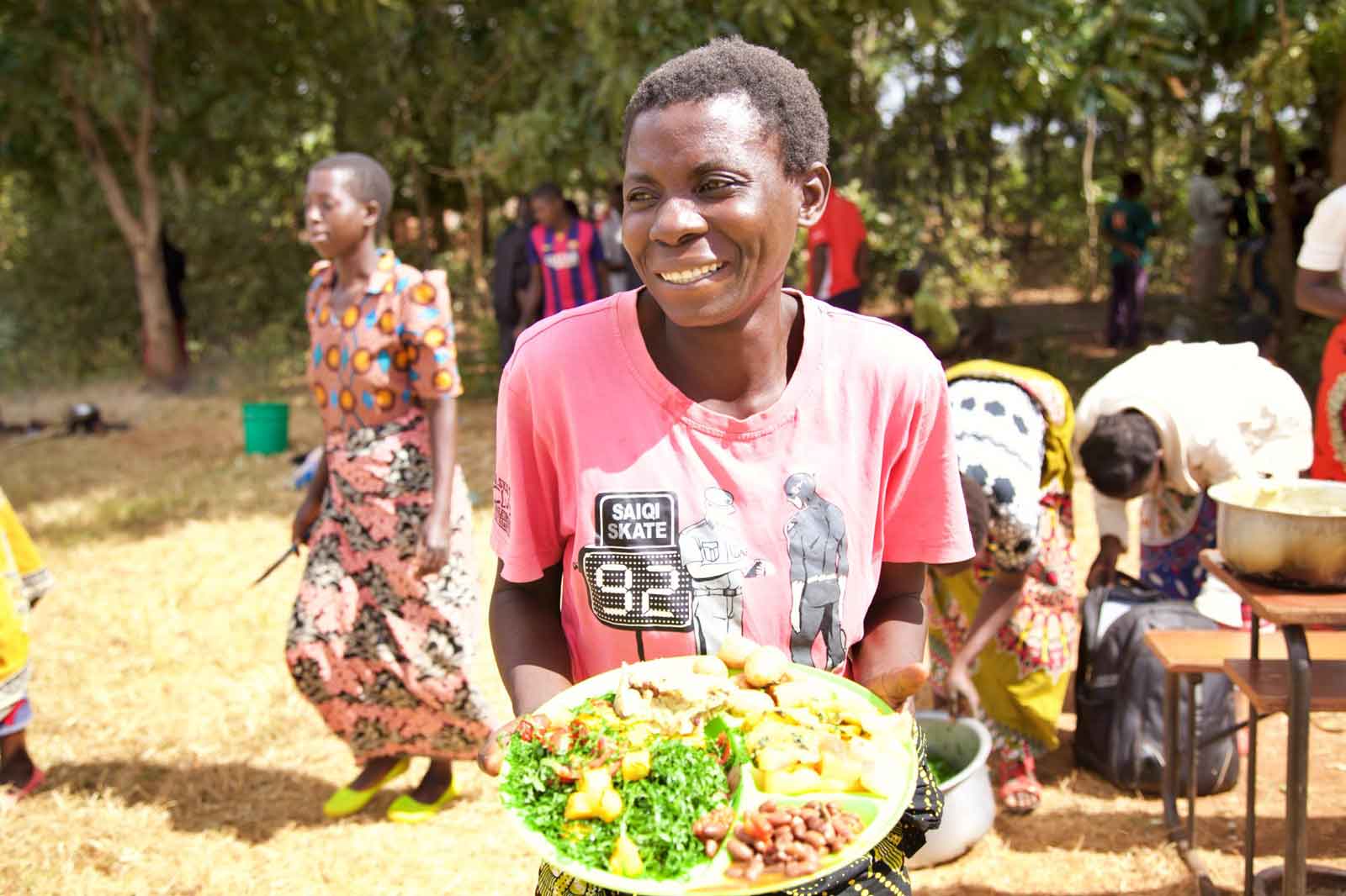 Permaculture training participant enjoying a diverse meal grown on the PPI farm.