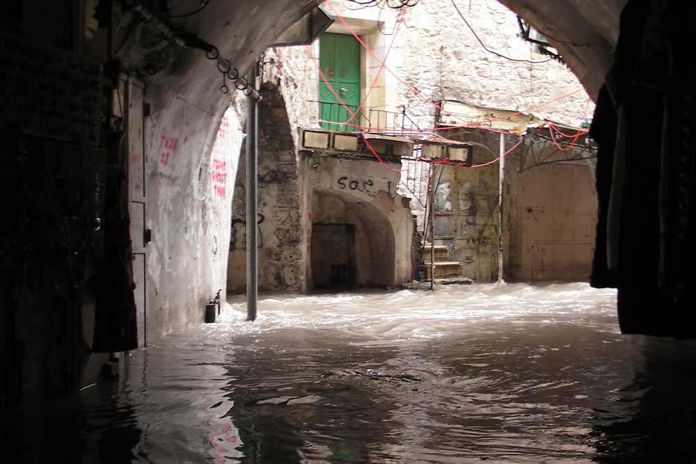Flooding in the Old City market. Credit: The Oakland Institute