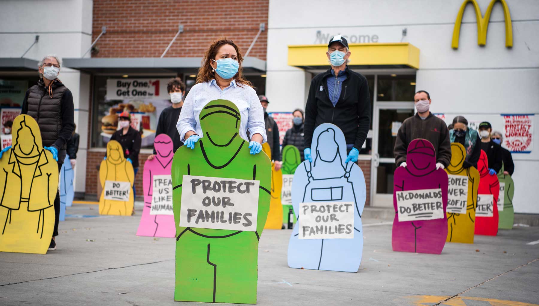 Faith and community leaders held silhouettes of striking workers, unable to attend due Covid-19.