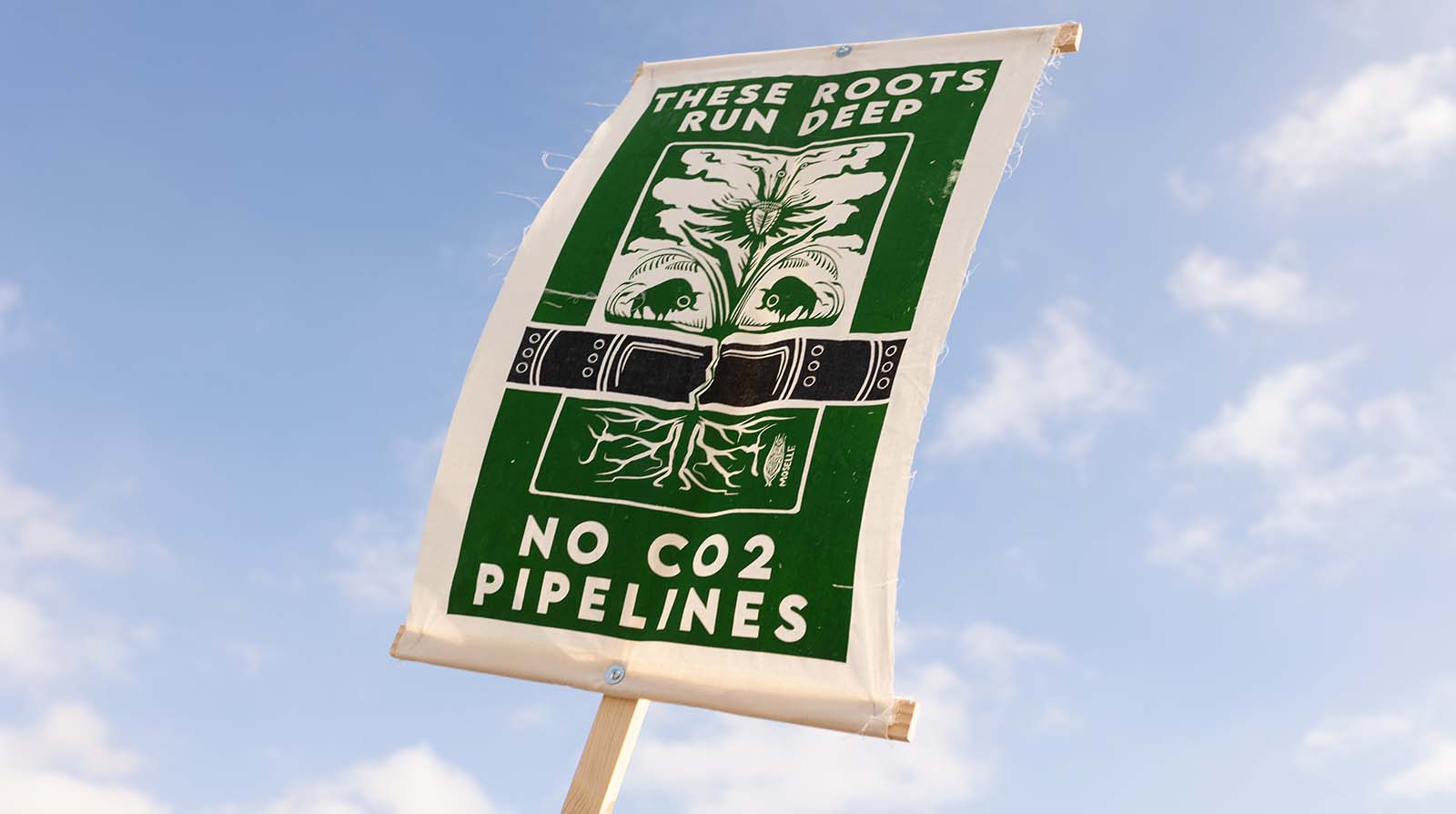 Closeup of sign at protest against Summit Carbon Solutions