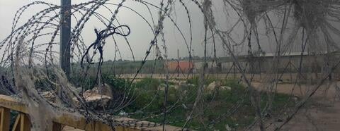 Barbwire to fortress the separation wall in Qalqilya. Credit: The Oakland Institute