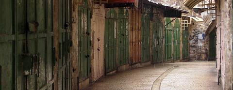 Welded shut doors of shops and homes in the Old City. Credit: The Oakland Institute