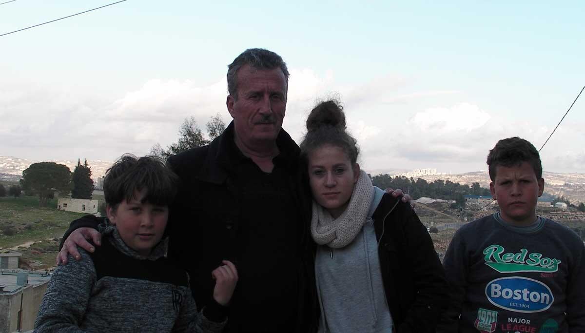 Bassem Tamimi with three of his children. Credit: The Oakland Institute