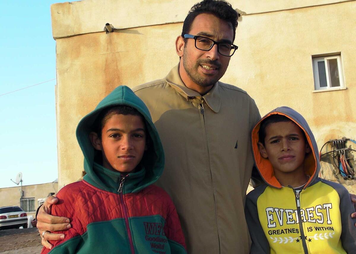 Abo Kweder with two young residents of Umm al-Hiran. Credit: The Oakland Institute