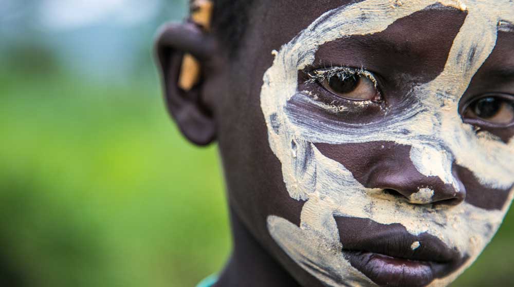 Suri boy with traditional face painting in the Kibish region of the Omo Valley, April 2018 © Kelly Fogel